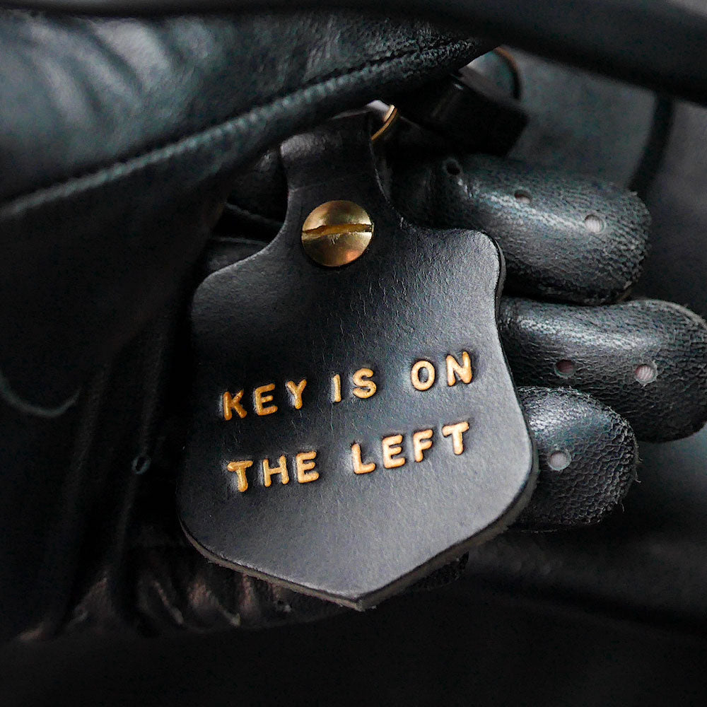 Leather Key Fob with embossed gold text Key Is On The Left